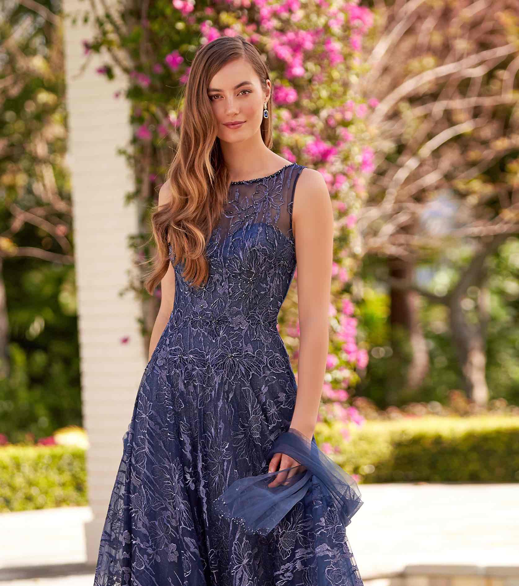 Model in blue sparkly Montage gown